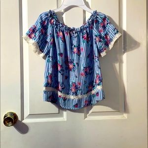 Floral off the shoulder shirt.